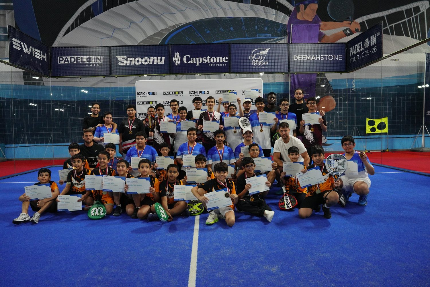 A Padel IN Academy junior camp group on court